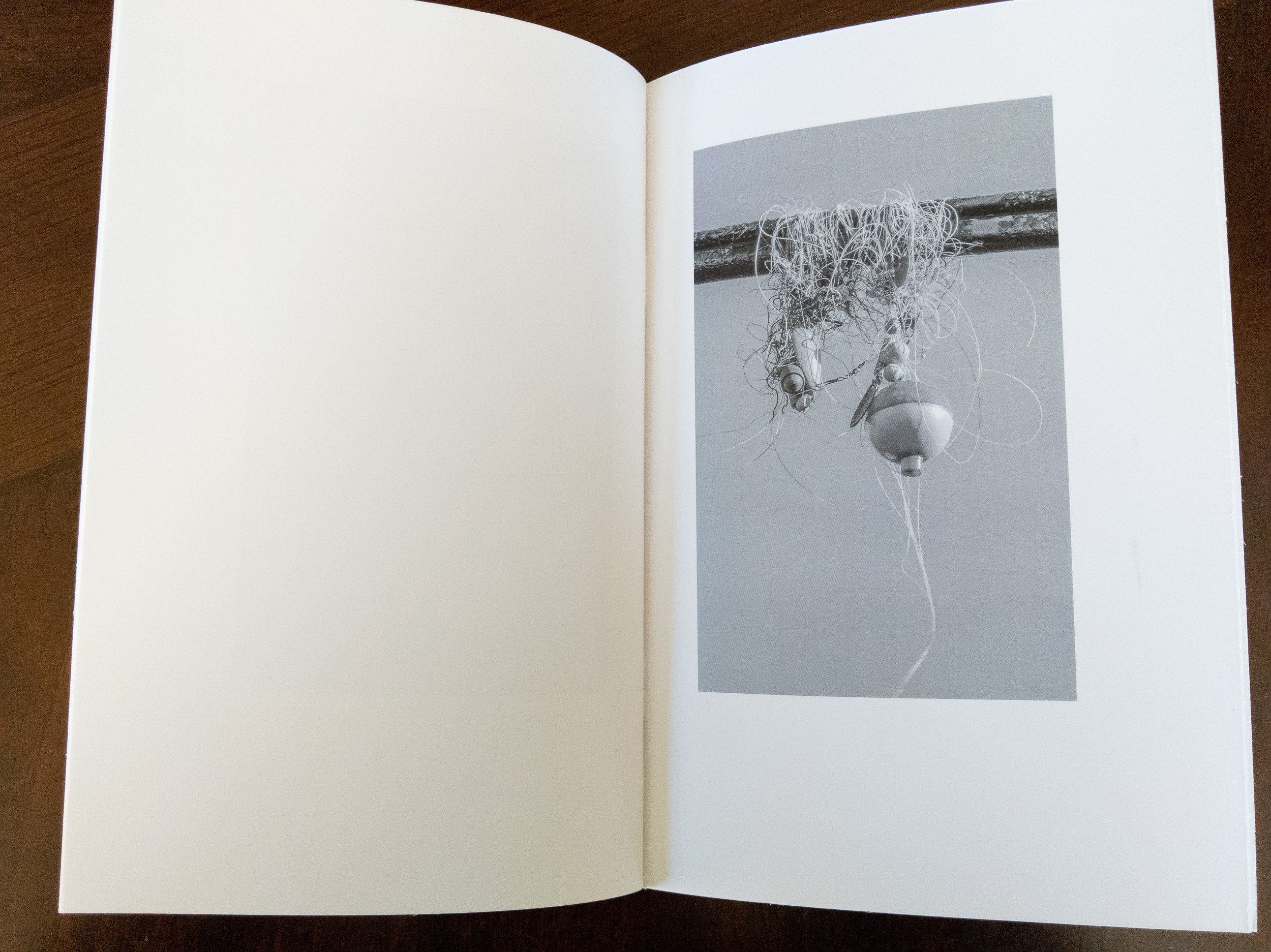 photograph of printed zine open to interior page, Hooks Lines Sinkers zine